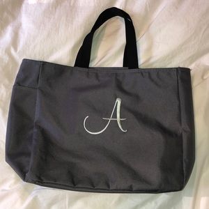 Grey monogrammed tote bag with letter A